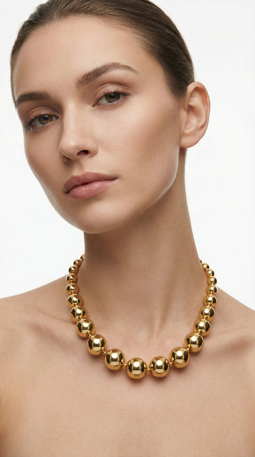 Collar de borlas dorado